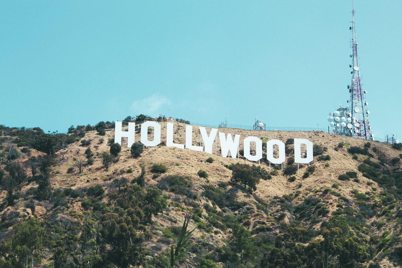 The Hollywood Sign on Mount Lee under a blue sky