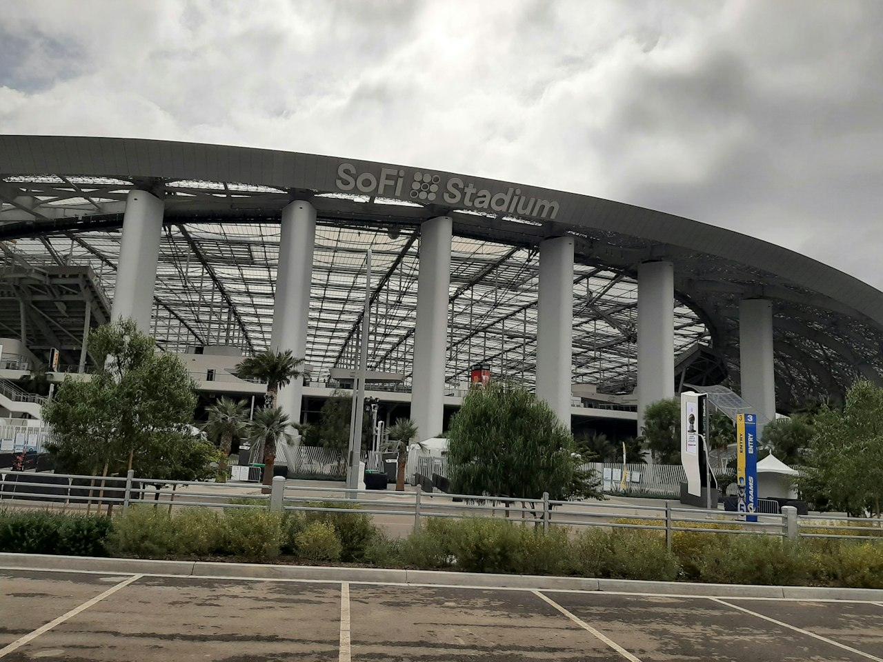 SoFi Stadium in Inglewood, its name on the curved facade